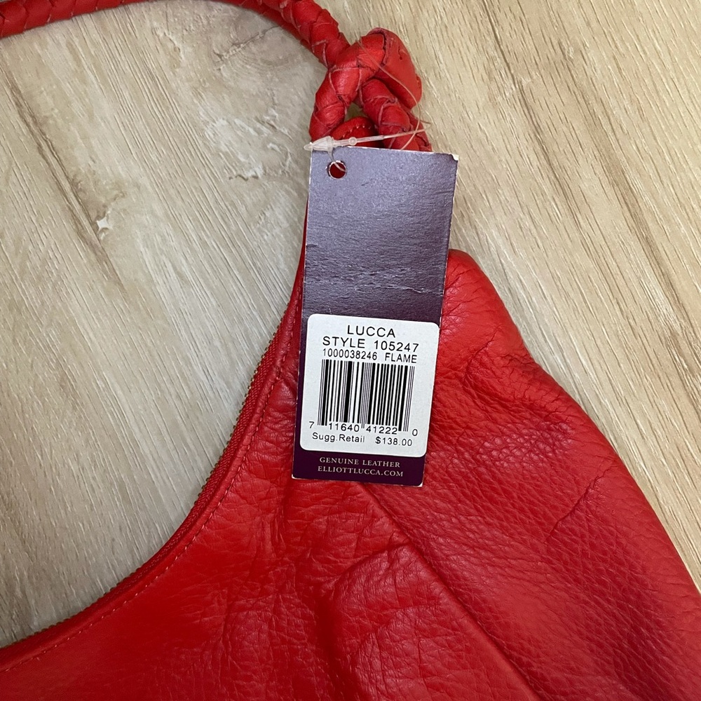 Elliott Lucca coral colored pocketbook. Brand new with tags.